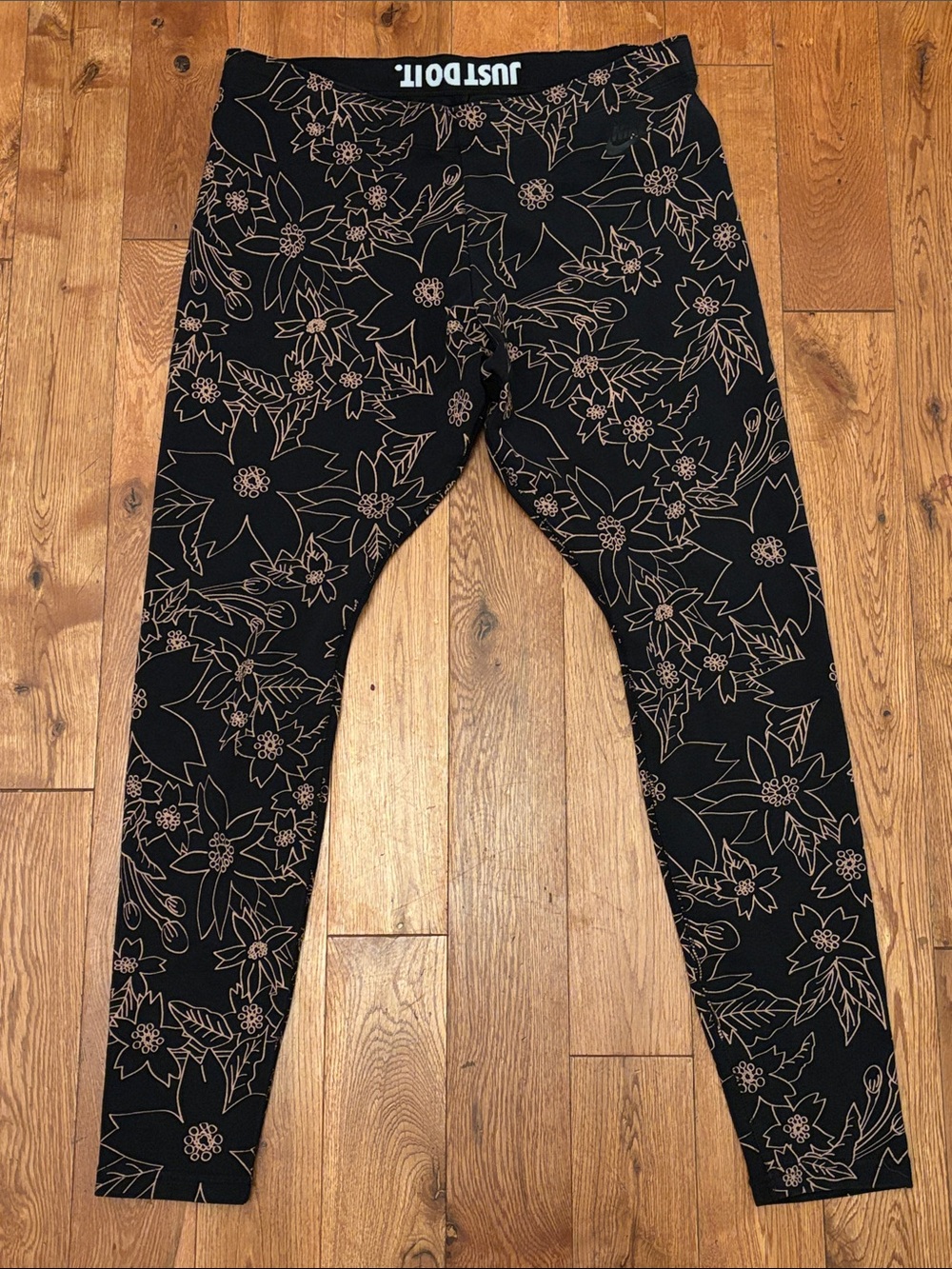 Nike Black Leggings with Beige Floral Outline and 'JUST DO IT' Waistband